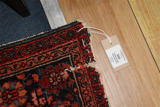 A Persian red ground rug 194 x 137cm